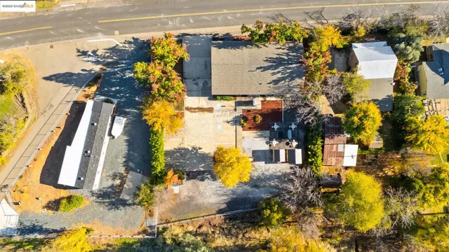 a living room with furniture a large window and a flat screen tv