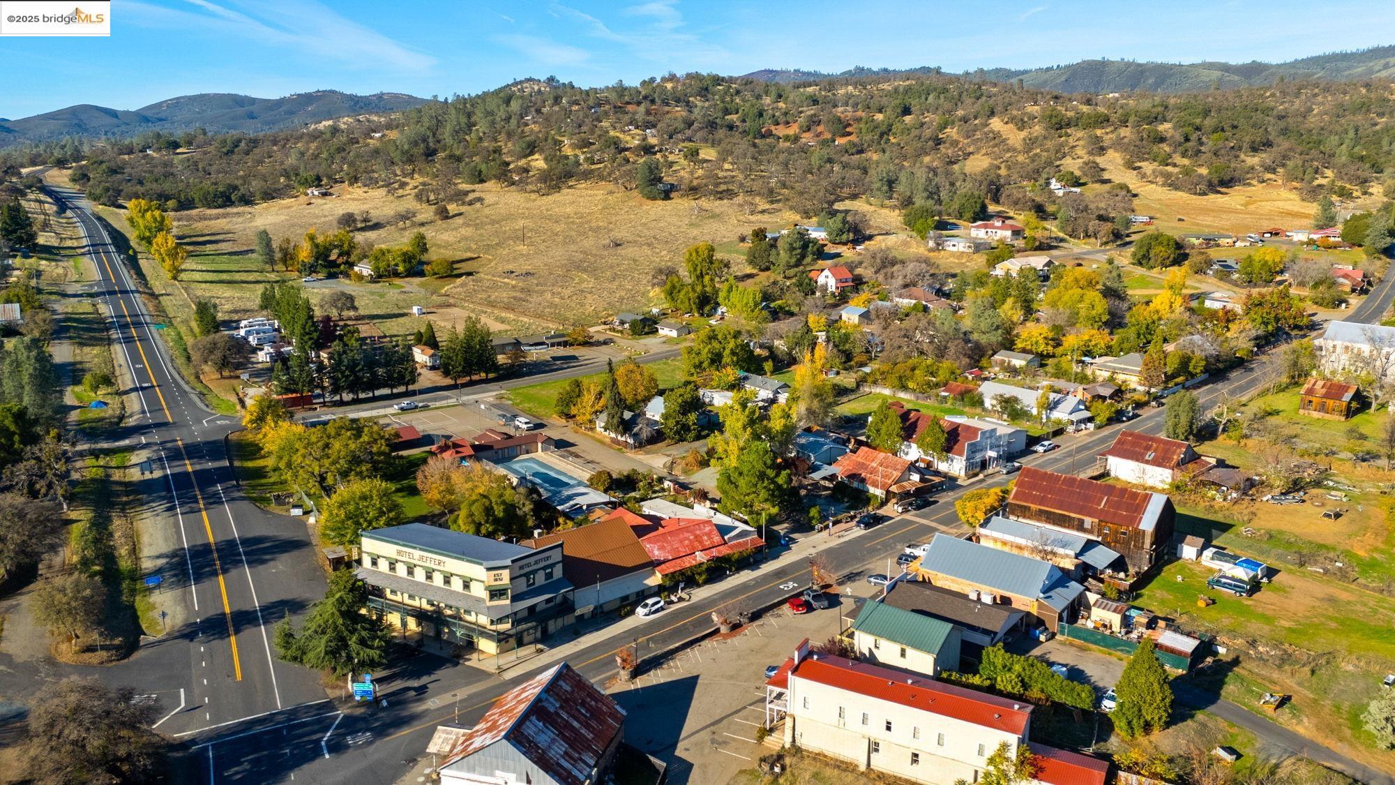 5033 Main Street Coulterville, CA 95311 - Photo 9 of 38 an aerial view of residential houses with outdoor space and street view
