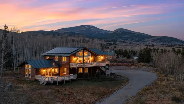 an outdoor space with swimming pool and mountain view
