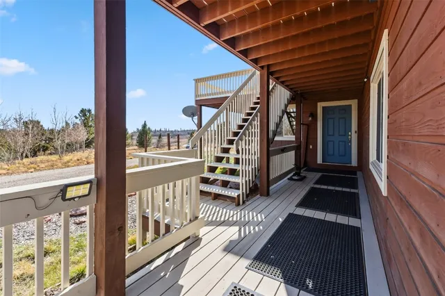 a view of balcony with wooden floor