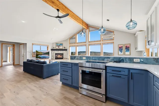 a kitchen with cabinets and window