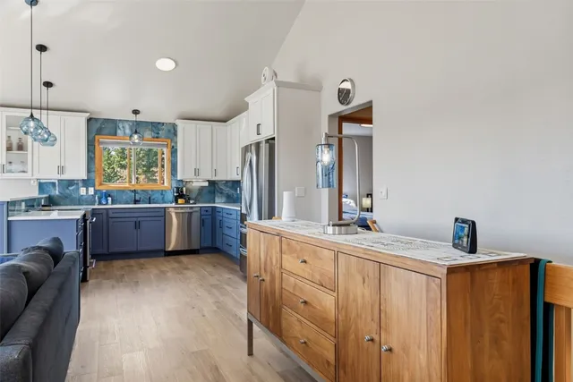 a large bathroom with a double vanity sink a mirror and a bathtub