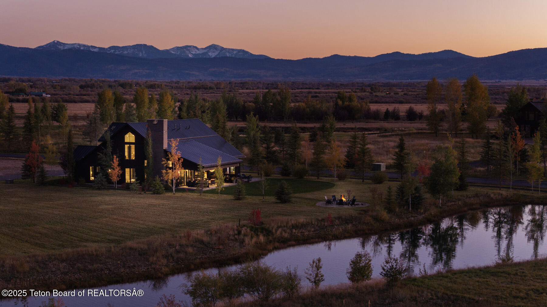 880 Sharp Tail Court Driggs, ID 83422 - Photo 1 of 30 1 Twilight Exterior Looking at Back of H