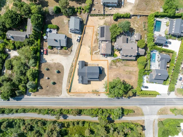 an aerial view of residential house with outdoor space