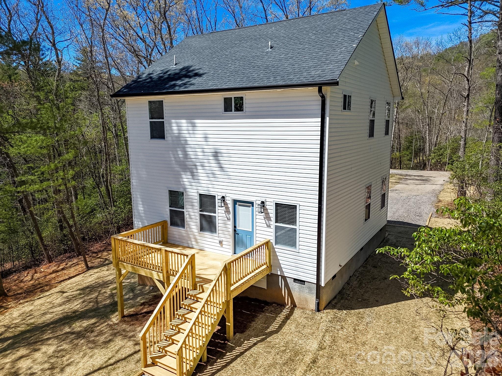 99 Lee Dotson Road Fairview, NC 28730 - Photo 5 of 47 a view of a house with backyard and trees