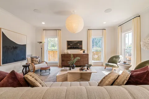 a dining room with table and chairs