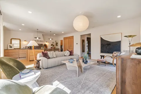 a bedroom with a bed and a ceiling fan