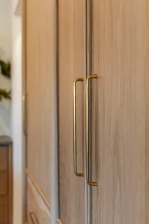 an aerial view of a house with a garden and trees