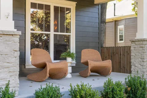 a living room with furniture and kitchen view