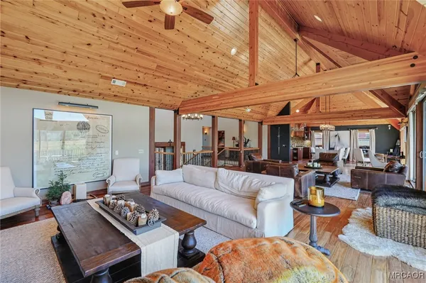 a outdoor living space with patio furniture and a fireplace