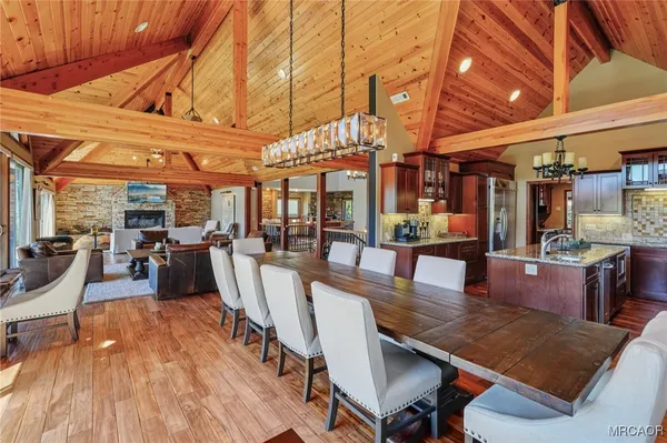 a kitchen with a stove and a wooden cabinets