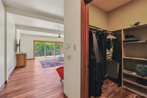 a view of an entryway with wooden floor and windows