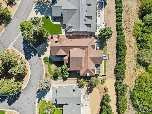 an aerial view of a house with a garden