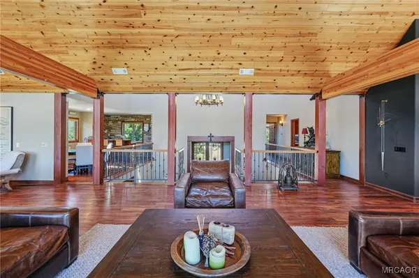 a living room with furniture a fireplace and a table
