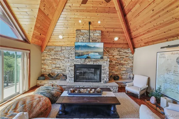 a living room with furniture and a floor to ceiling window