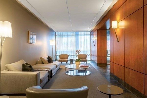 a view of a livingroom with furniture and a window