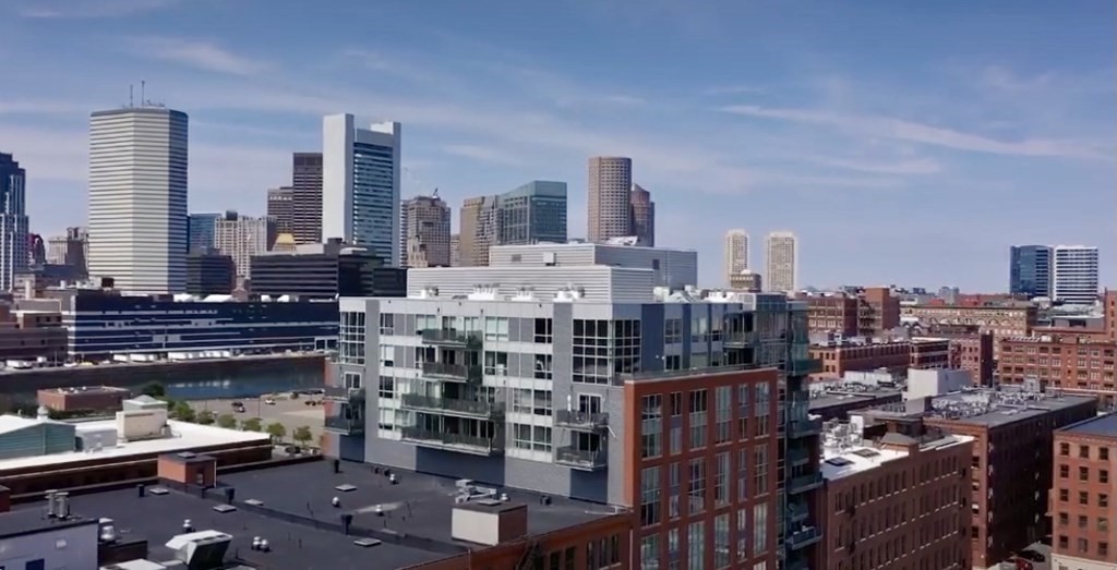 25 Channel Center Street, Unit 202 Boston, MA 02210 - Photo 15 of 18 a city view with tall buildings