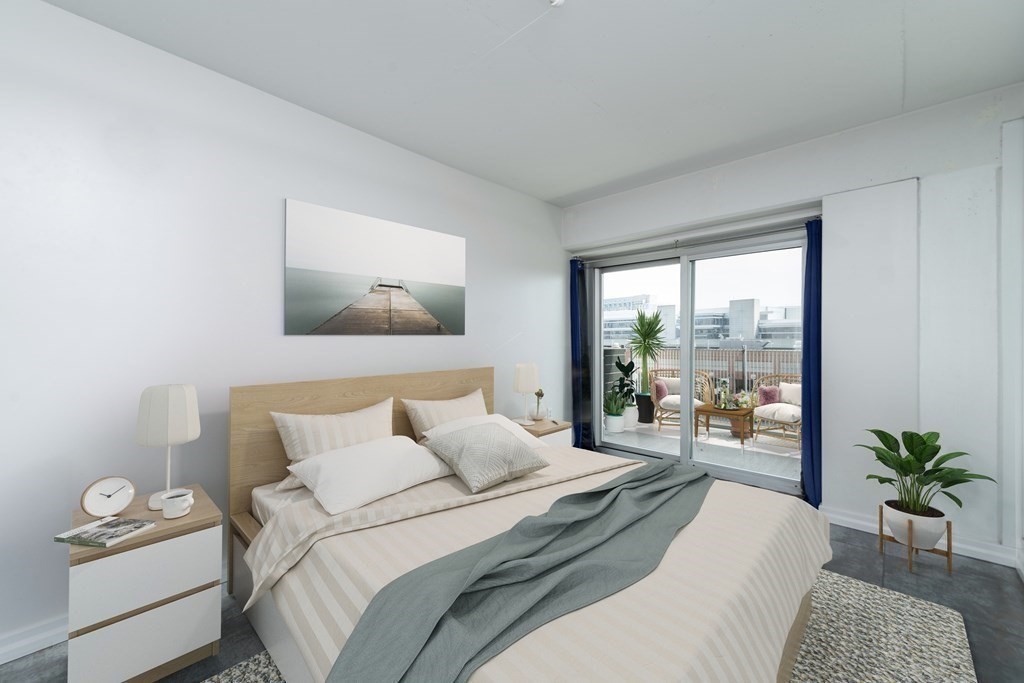 25 Channel Center Street, Unit 202 Boston, MA 02210 - Photo 4 of 18 a bedroom with a bed and a large window