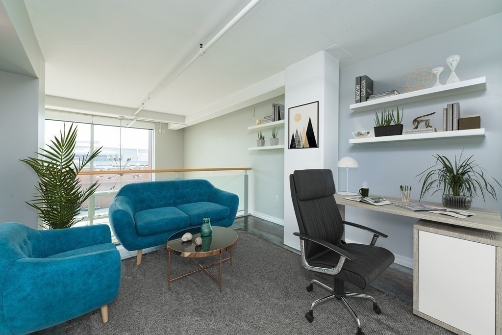 25 Channel Center Street, Unit 202 Boston, MA 02210 - Photo 10 of 18 a view of a workspace with furniture and a window