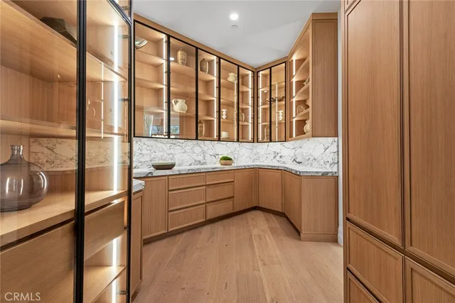 a kitchen with stainless steel appliances granite countertop a sink and cabinets