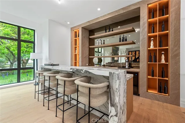 a kitchen with a table chairs and a window
