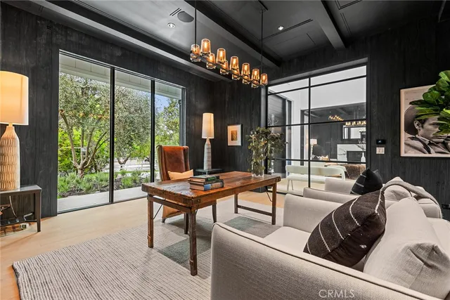 a work room with furniture and a large window