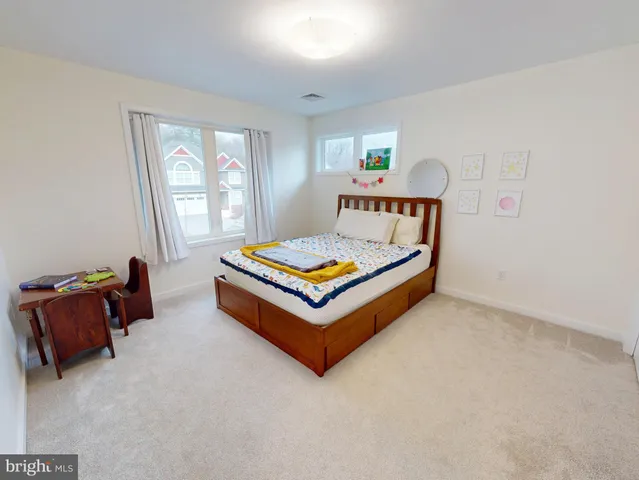 a living room with furniture and windows