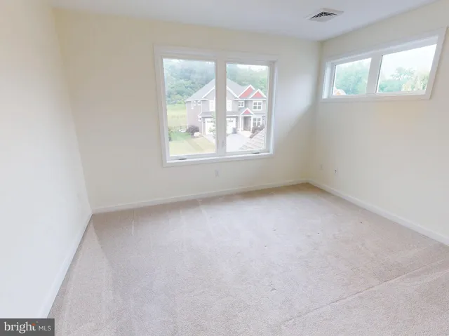 an empty room with windows