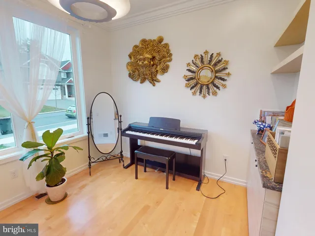 a blue chair sitting in a room next to a window