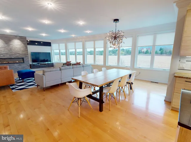 a living room with fireplace furniture and a flat screen tv