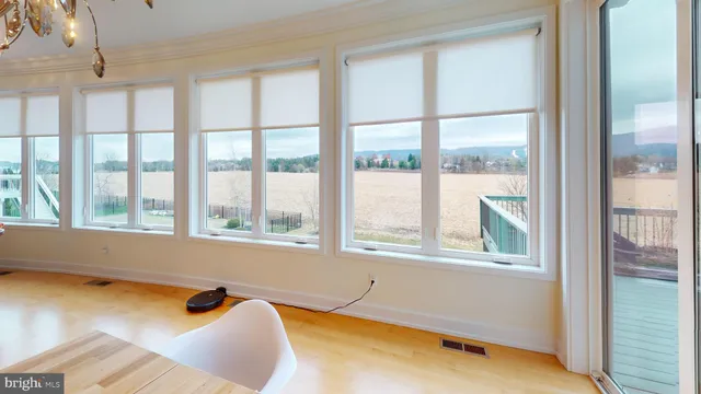 a bed sitting in a room next to a window