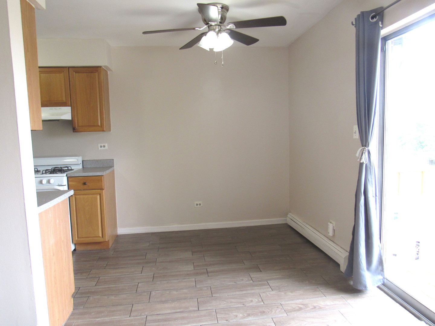 1156 Copperfield Lane, Unit C Schaumburg, IL 60193 - Photo 6 of 12 a view of a kitchen with a sink and a window