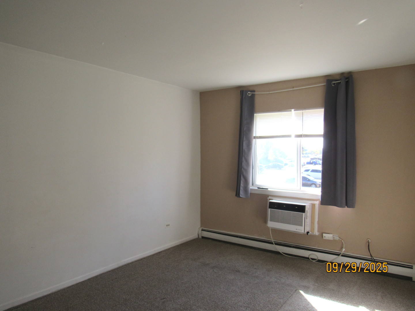 1156 Copperfield Lane, Unit C Schaumburg, IL 60193 - Photo 7 of 12 an empty room with a window
