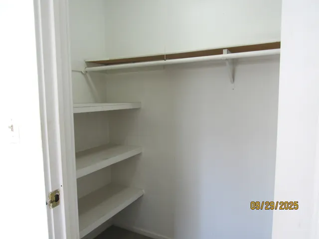 a view of an empty walk in closet