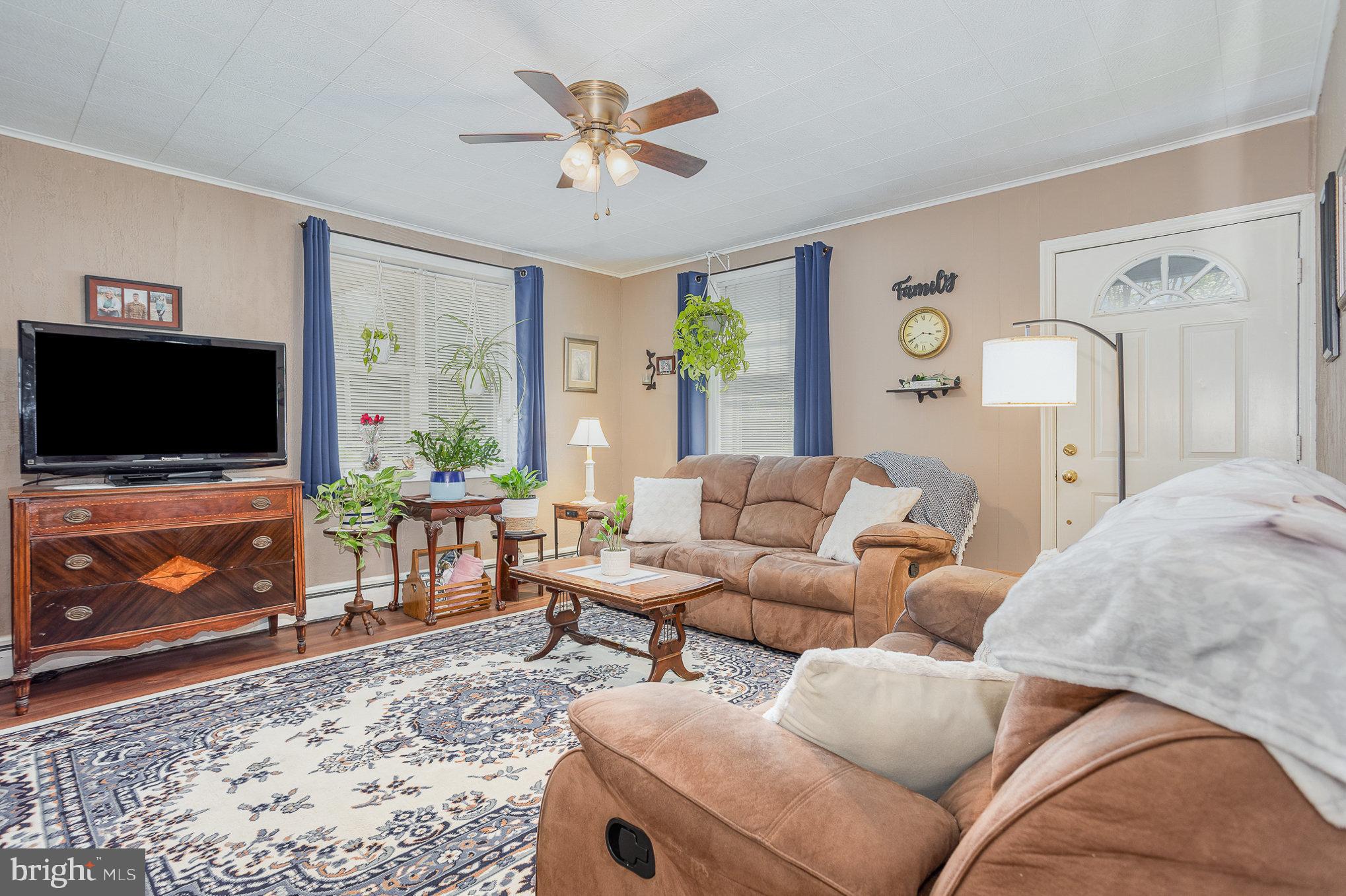 1243 Rawlinsville Road New Providence, PA 17560 - Photo 8 of 35 a living room with furniture and a flat screen tv