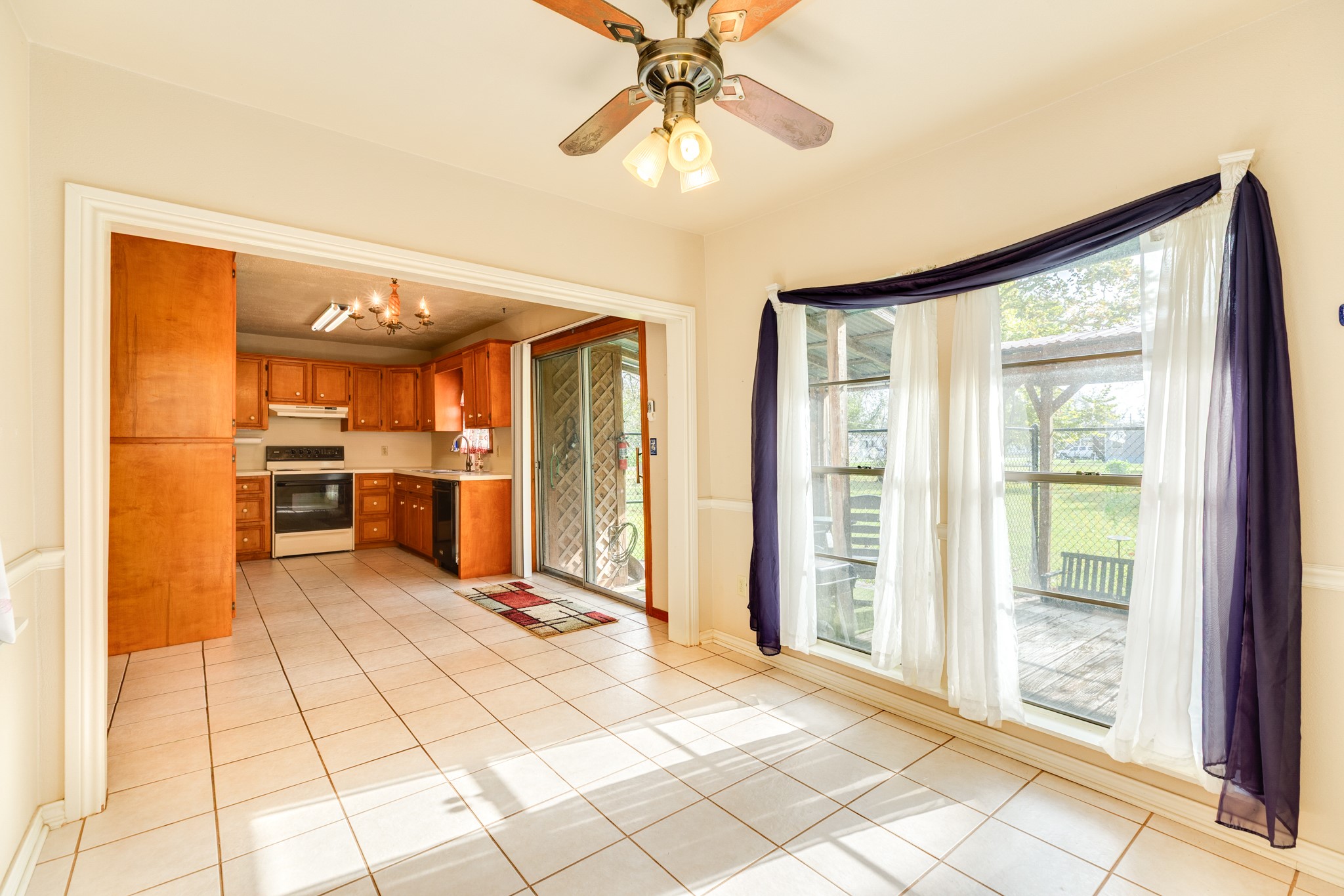 404 Chestnut Street Brazoria, TX 77422 - Photo 15 of 30 a view of an entryway with wooden floor and a kitchen