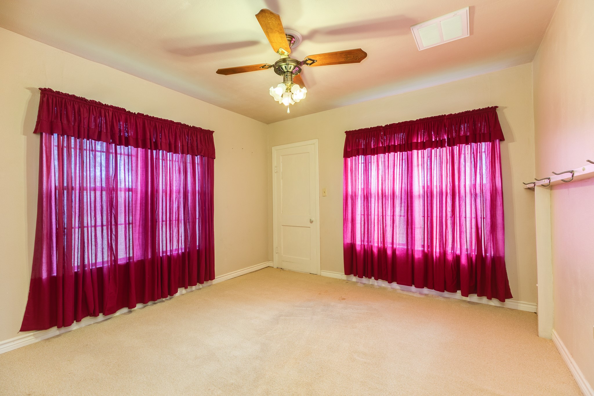 404 Chestnut Street Brazoria, TX 77422 - Photo 21 of 30 a view of a room with red walls and a window