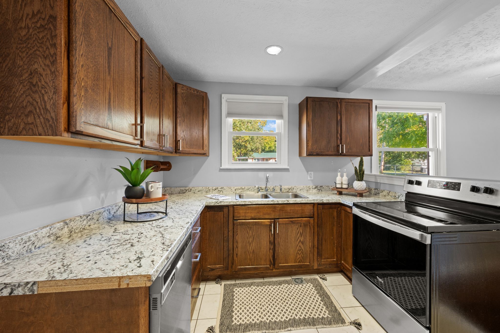 1105 Taylortown Road White Bluff, TN 37187 - Photo 12 of 27 a kitchen with stainless steel appliances granite countertop a sink stove and cabinets