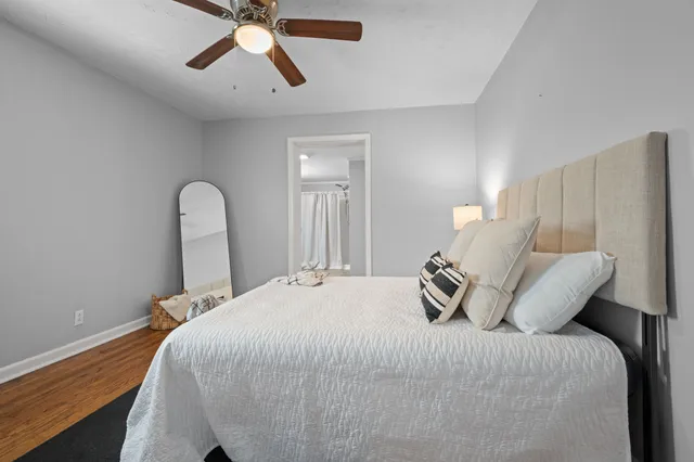 a bedroom with a bed and window