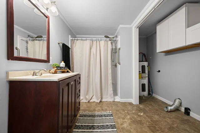 a bathroom with a sink and a mirror