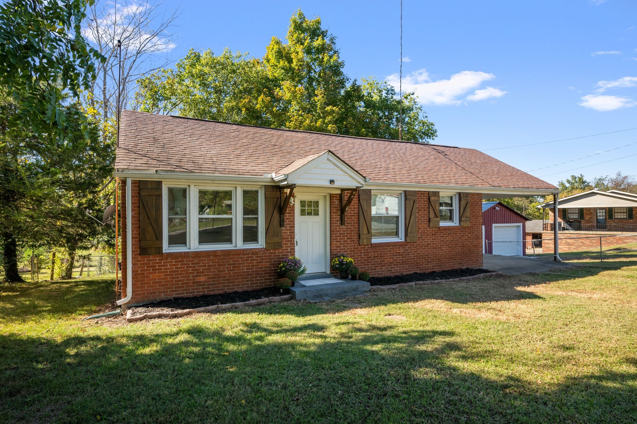 1105 Taylortown Road White Bluff, TN 37187 - Photo 2 of 27 a front view of a house with a garden and yard