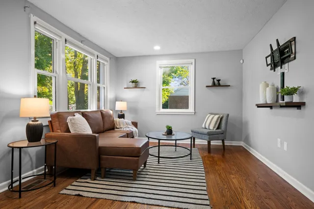 a living room with furniture and a window