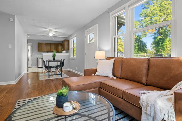 a living room with furniture and a large window