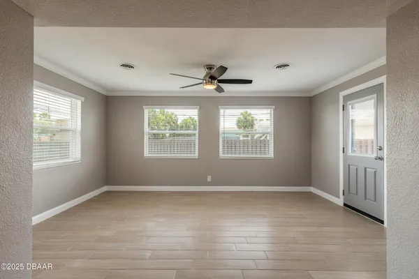 a view of an empty room with a window