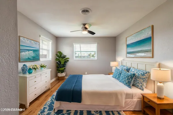 a bedroom with a bed and a dresser in it