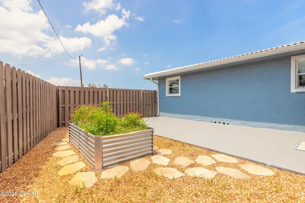 a view of a back yard from a balcony