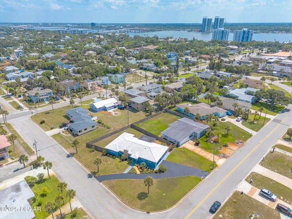 an aerial view of residential houses with outdoor space
