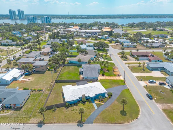 an aerial view of residential houses with outdoor space