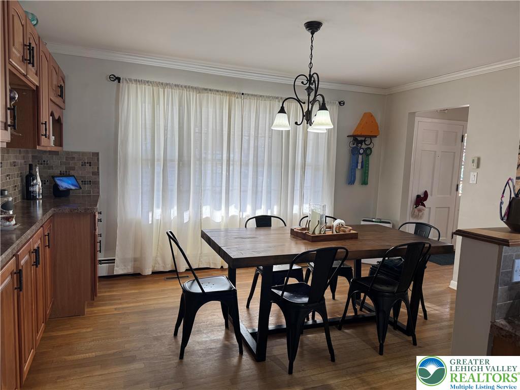 717 Liberty Street Emmaus, PA 18049 - Photo 11 of 35 a view of a dining room with furniture window and wooden floor