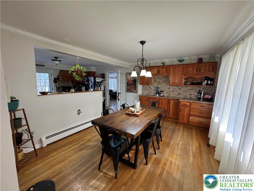 717 Liberty Street Emmaus, PA 18049 - Photo 12 of 35 a view of a dining room with furniture and wooden floor
